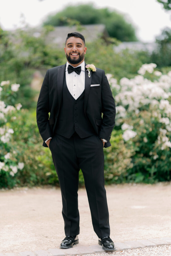 Handsome groom in wedding suit, fine art wedding photography by Camilla Joy