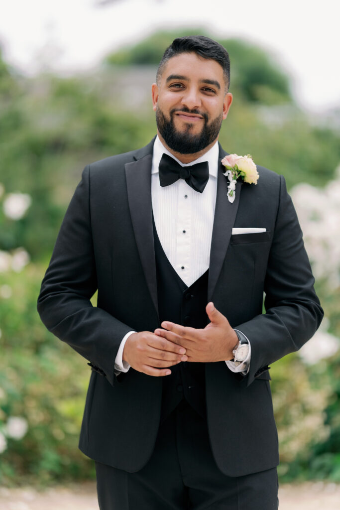 Groom's wedding details including cufflinks and boutonniere