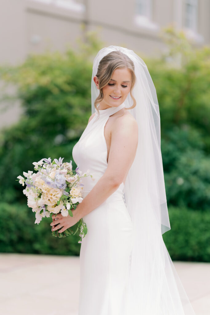 Beautiful bride Natalie in flowing wedding gown at Burtonfields Hall countryside