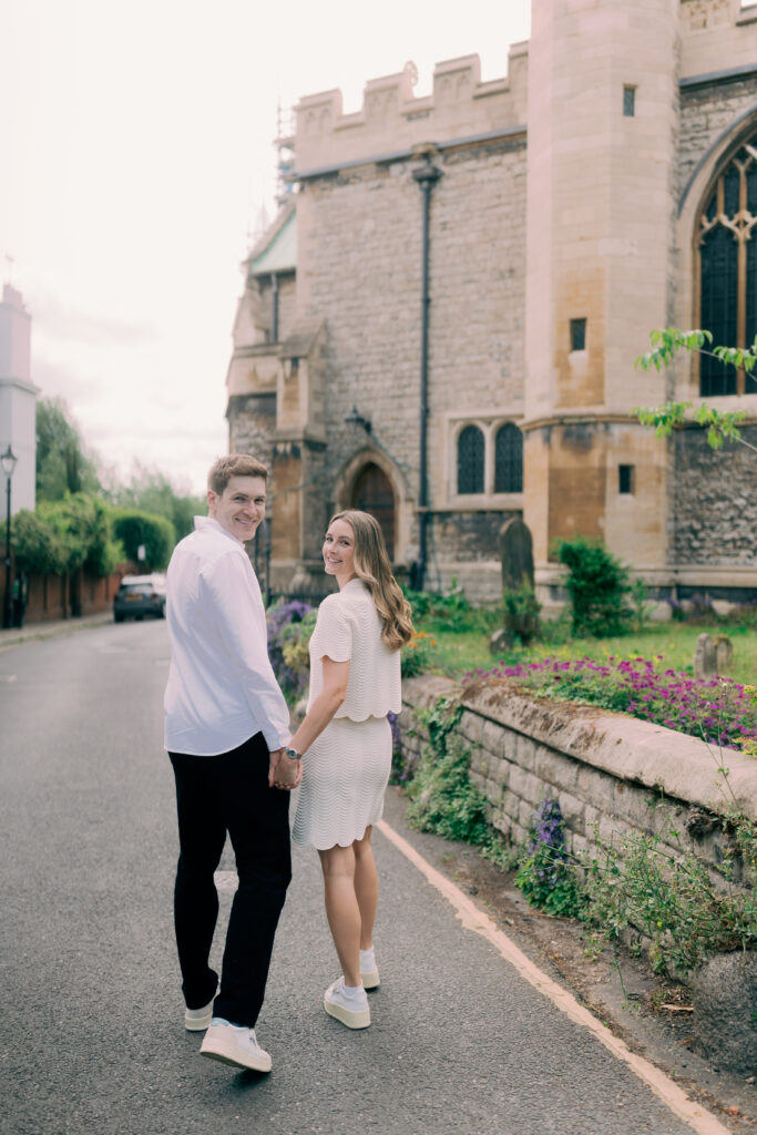 Couple walking through London during their engagement shoot.