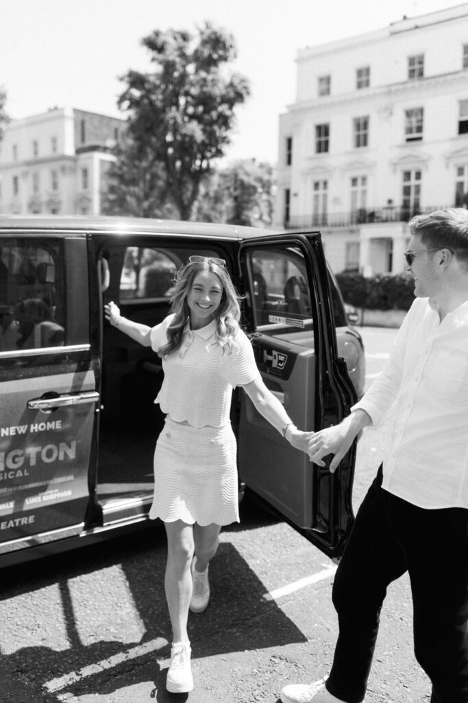 Timeless wedding portrait couple with black taxi London architecture