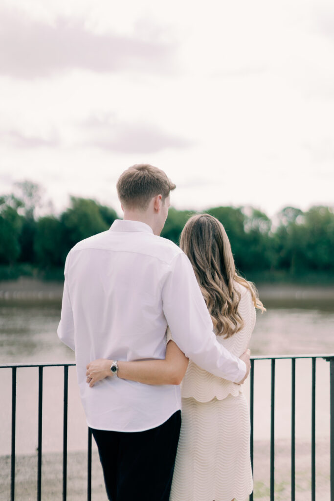 Couple admiring view at Chiswick waterfront for their engagement shoot