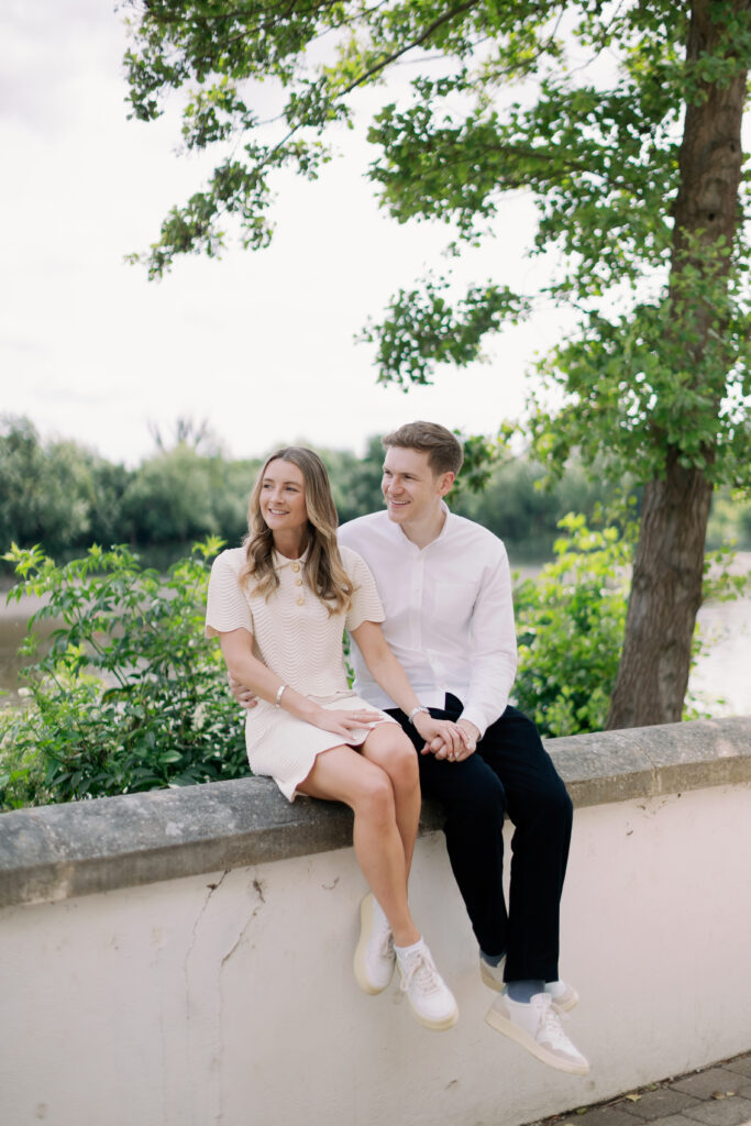 Natural moment captured during waterfront stroll Chiswick London engagement photography