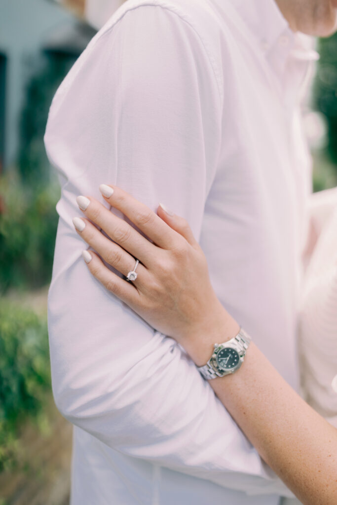 Elegant engagement ring detail shot with spring flowers London