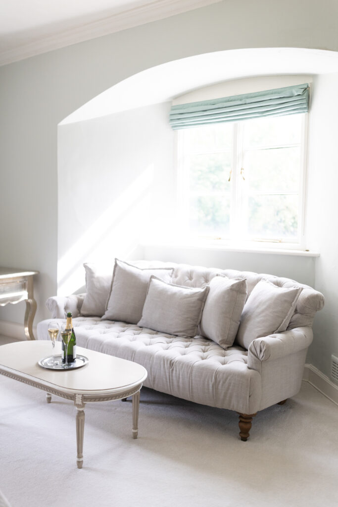 Charming sitting room at Casterton Grange with cozy seating and countryside views